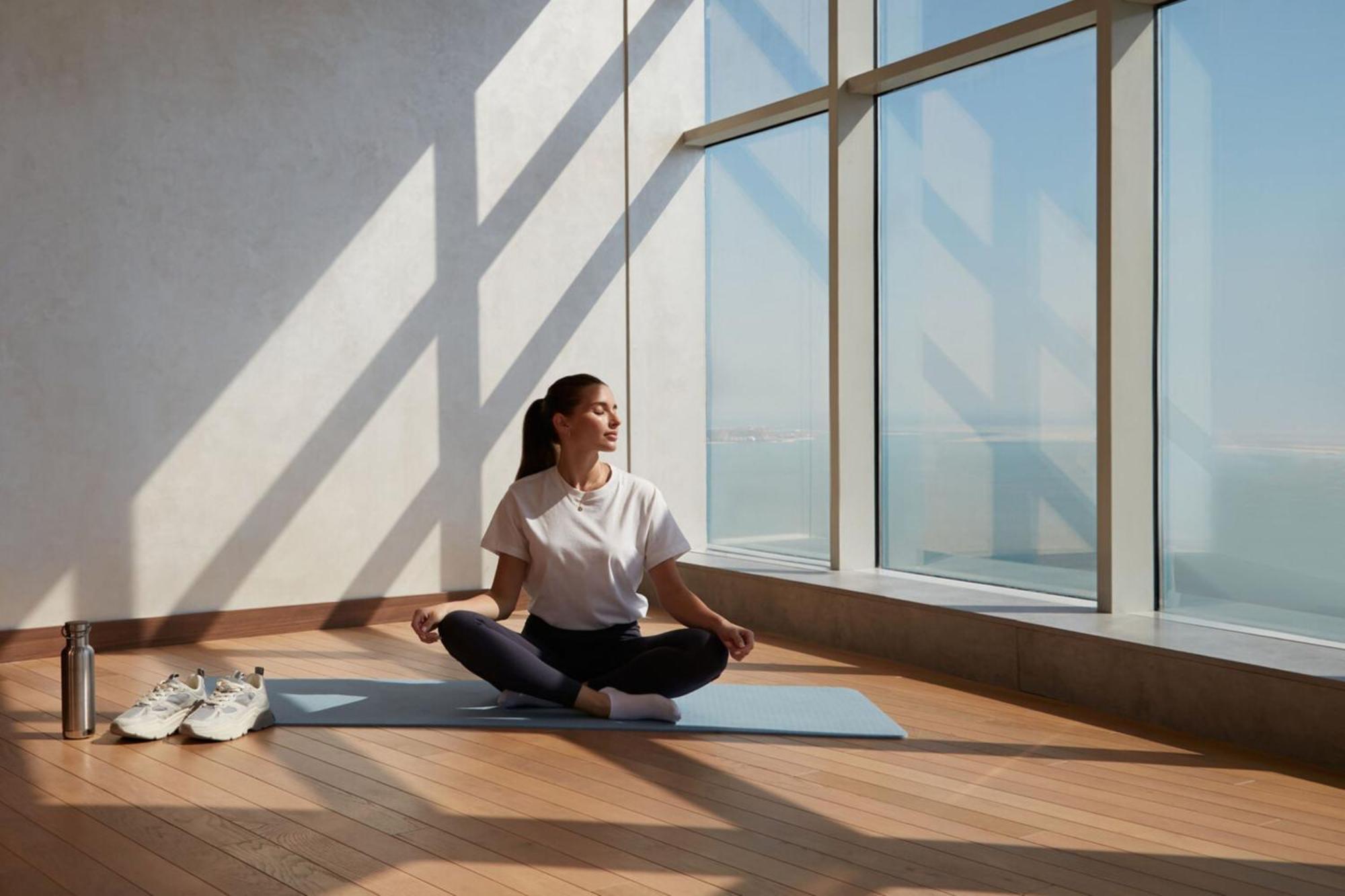 Element By Westin West Bay Doha Hotel Luaran gambar A woman meditating